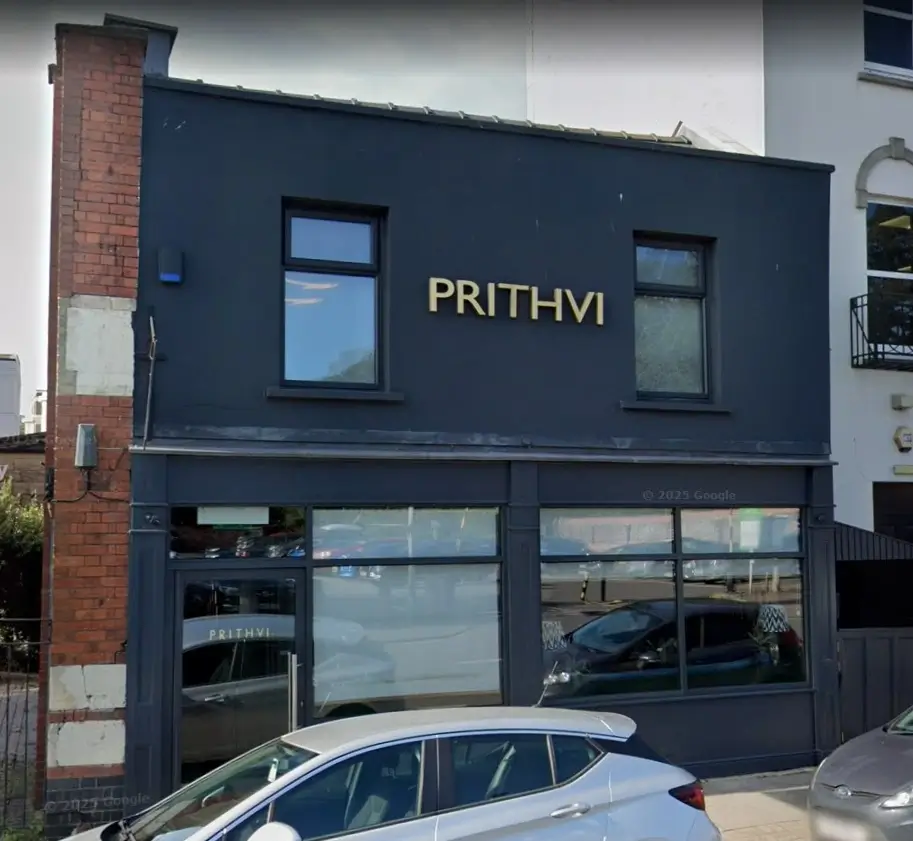 Prithvi restaurant exterior — dark, confident colour that signals quality from the street